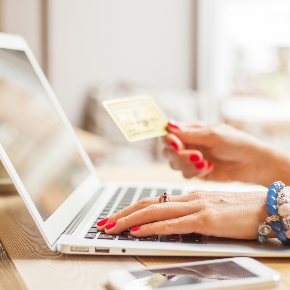 ECommerce SEO image customer using card to make online purchase